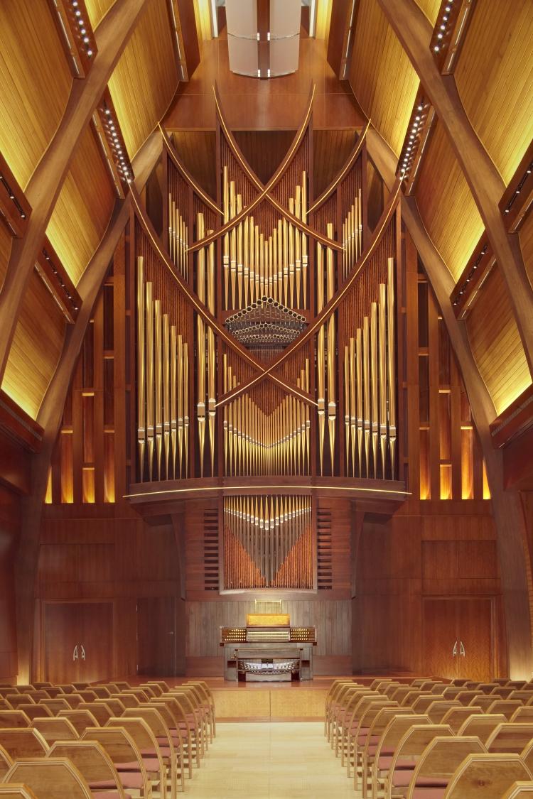 a organ in a church made of wood
