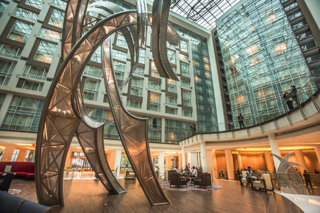 a large metal sculpture in a hotel lobby