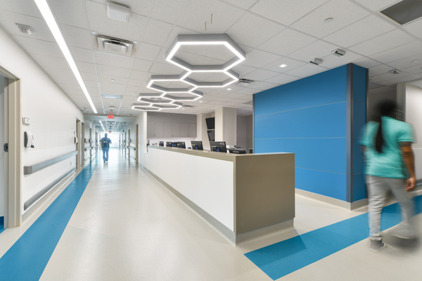 A nursing station with distinctive lighting inside a hospital