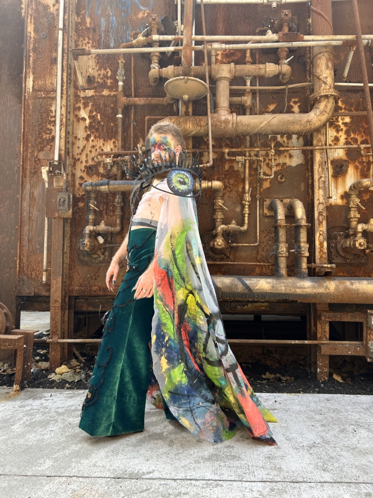 A model poses in an industrial setting